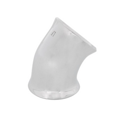 a white vase sitting on top of a white table