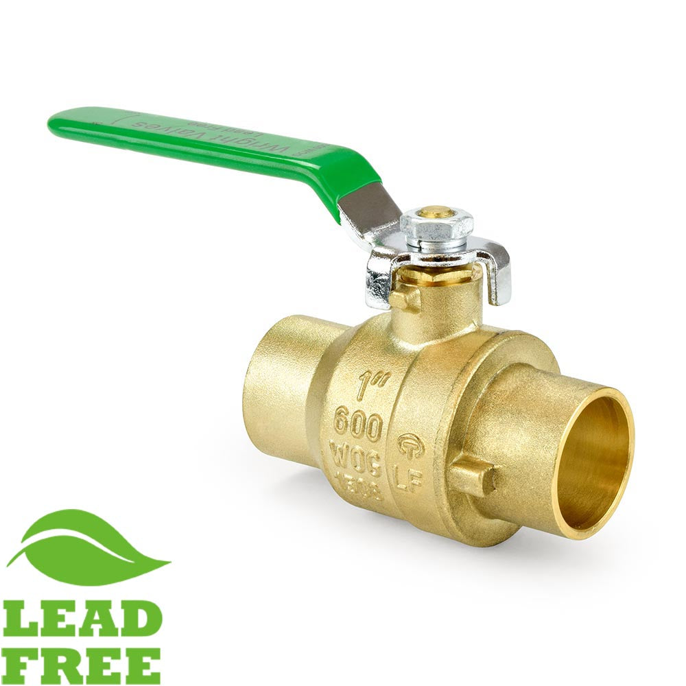 a brass ball valve with a green handle